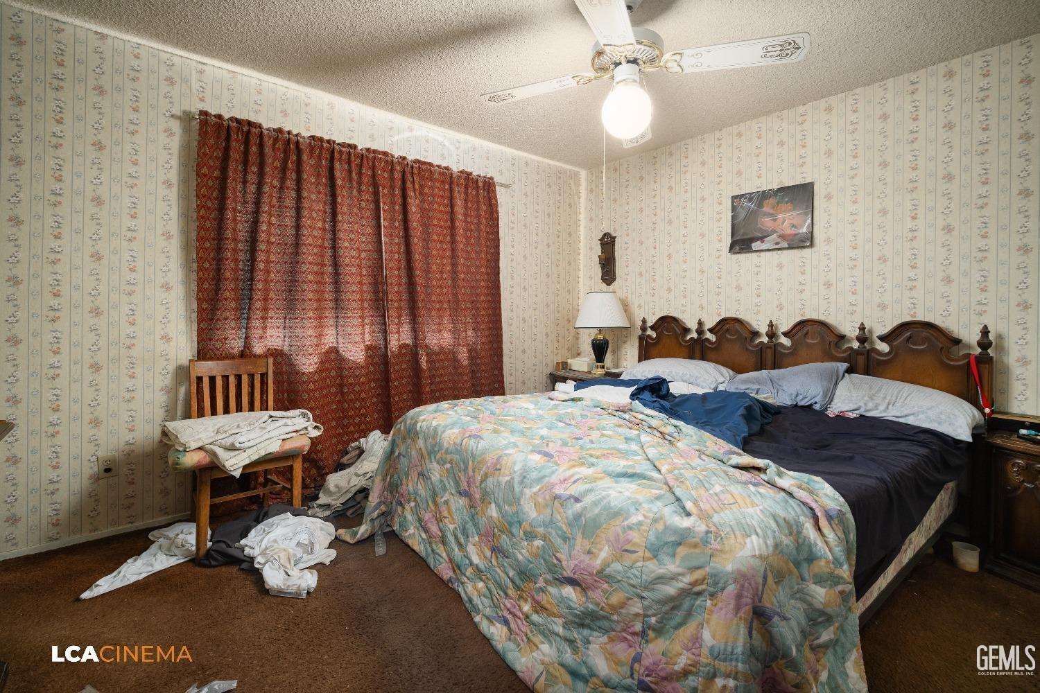 Undisclosed Address Bakersfield, CA 93304 - Photo 12 of 15 a bed room with a bed and a window