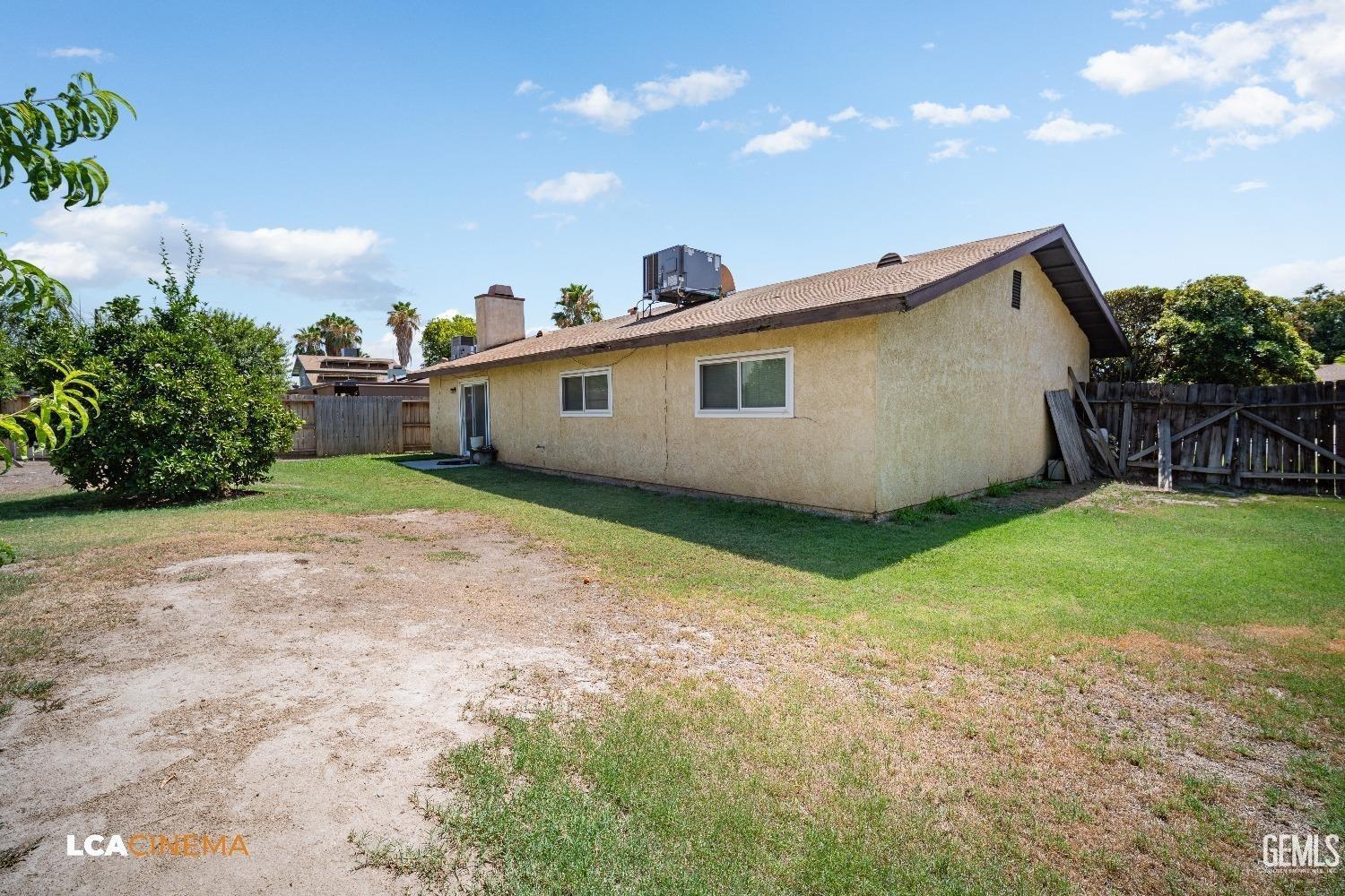 Undisclosed Address Bakersfield, CA 93304 - Photo 13 of 15 a view of a house with backyard and garden