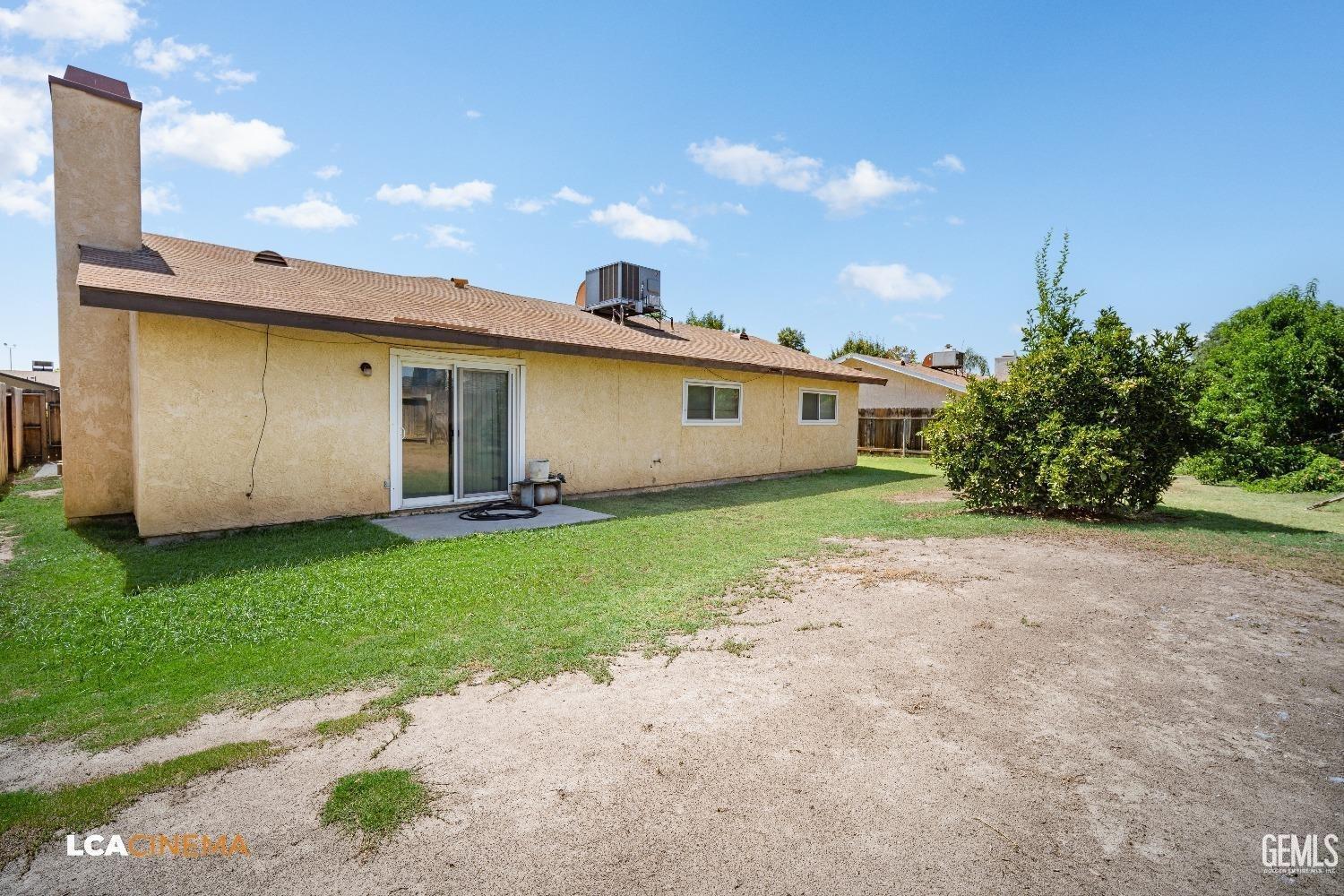Undisclosed Address Bakersfield, CA 93304 - Photo 15 of 15 a view of a house with backyard and garden