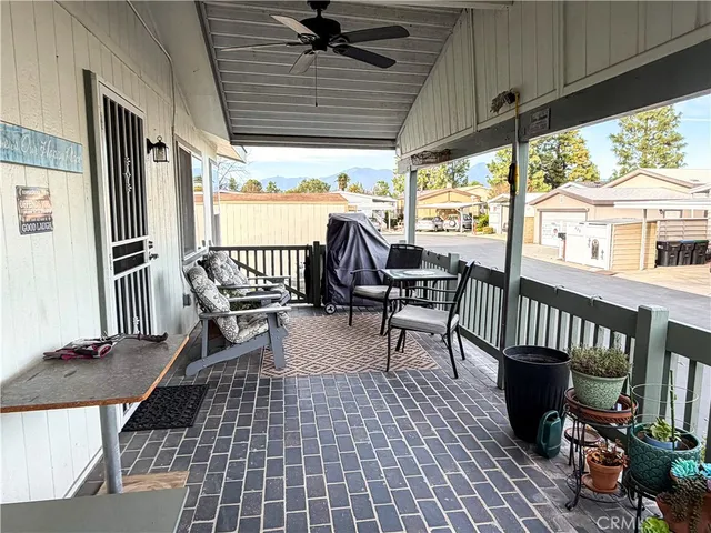 a view of a patio with wooden floor