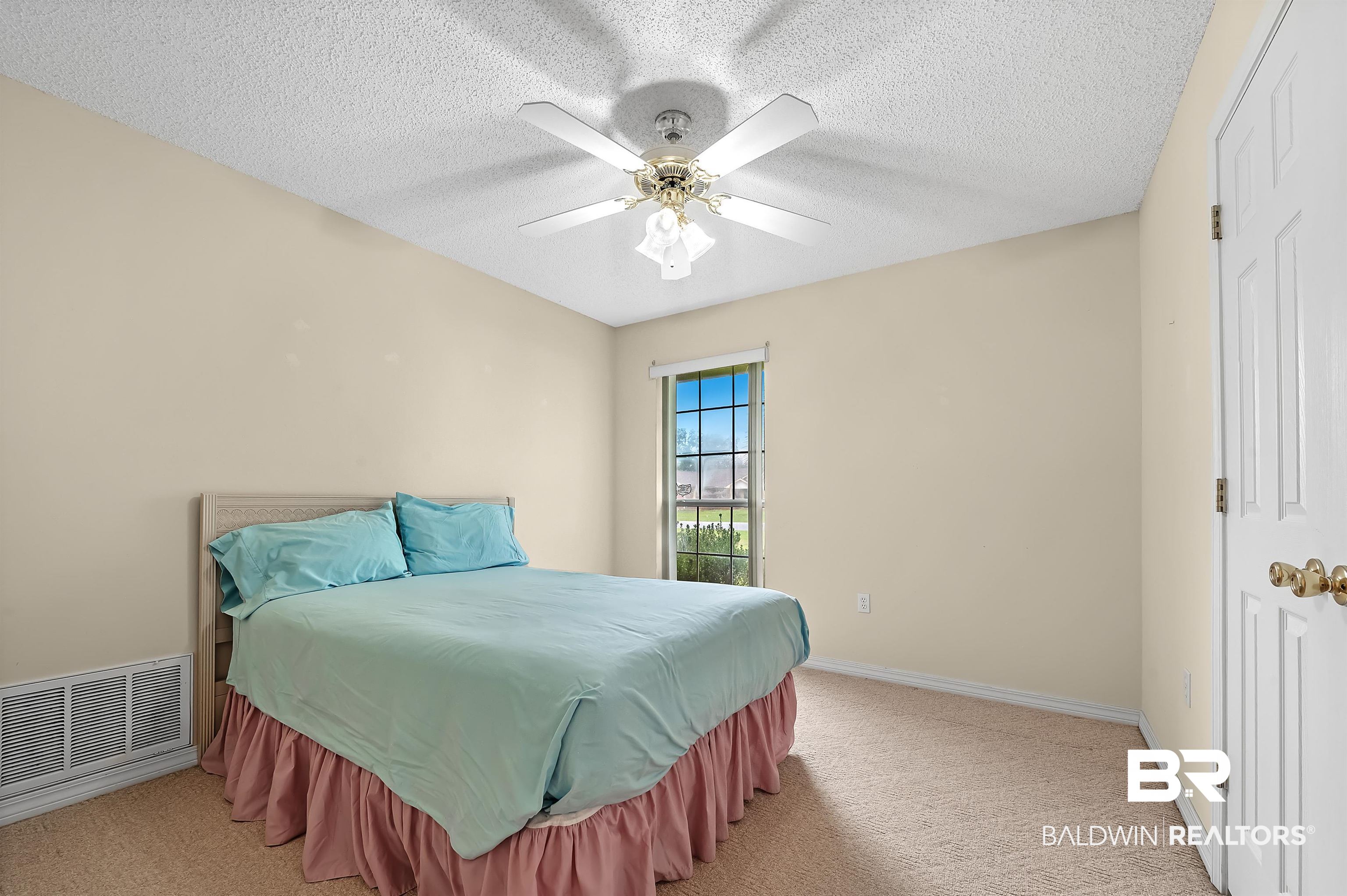 1502 Mulberry Lane Foley, AL 36535 - Photo 27 of 45 Carpeted bedroom with a textured ceiling and ceiling fan