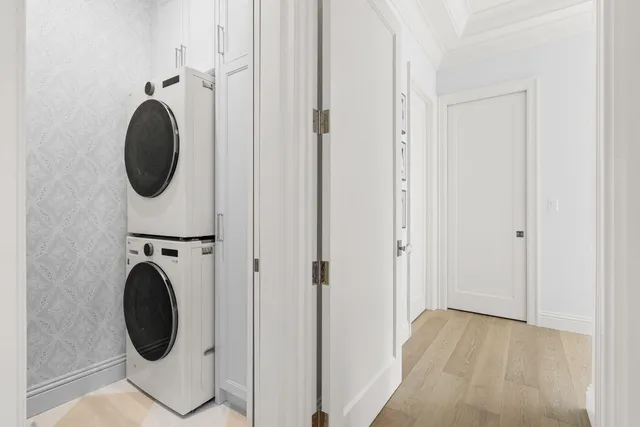 a view of a hallway with washer and dryer