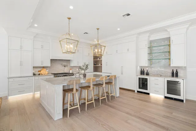 a kitchen with a stove a sink and a refrigerator