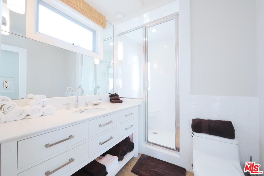 31008 Broad Beach Road Malibu, CA 90265 - Photo 23 of 40 a bathroom with a sink a toilet and a mirror