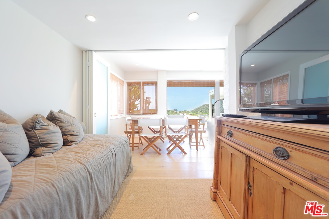 31008 Broad Beach Road Malibu, CA 90265 - Photo 24 of 40 a bedroom with furniture and a large window