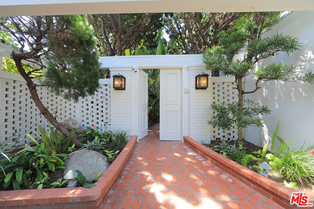 31008 Broad Beach Road Malibu, CA 90265 - Photo 7 of 40 a front view of a house with garden