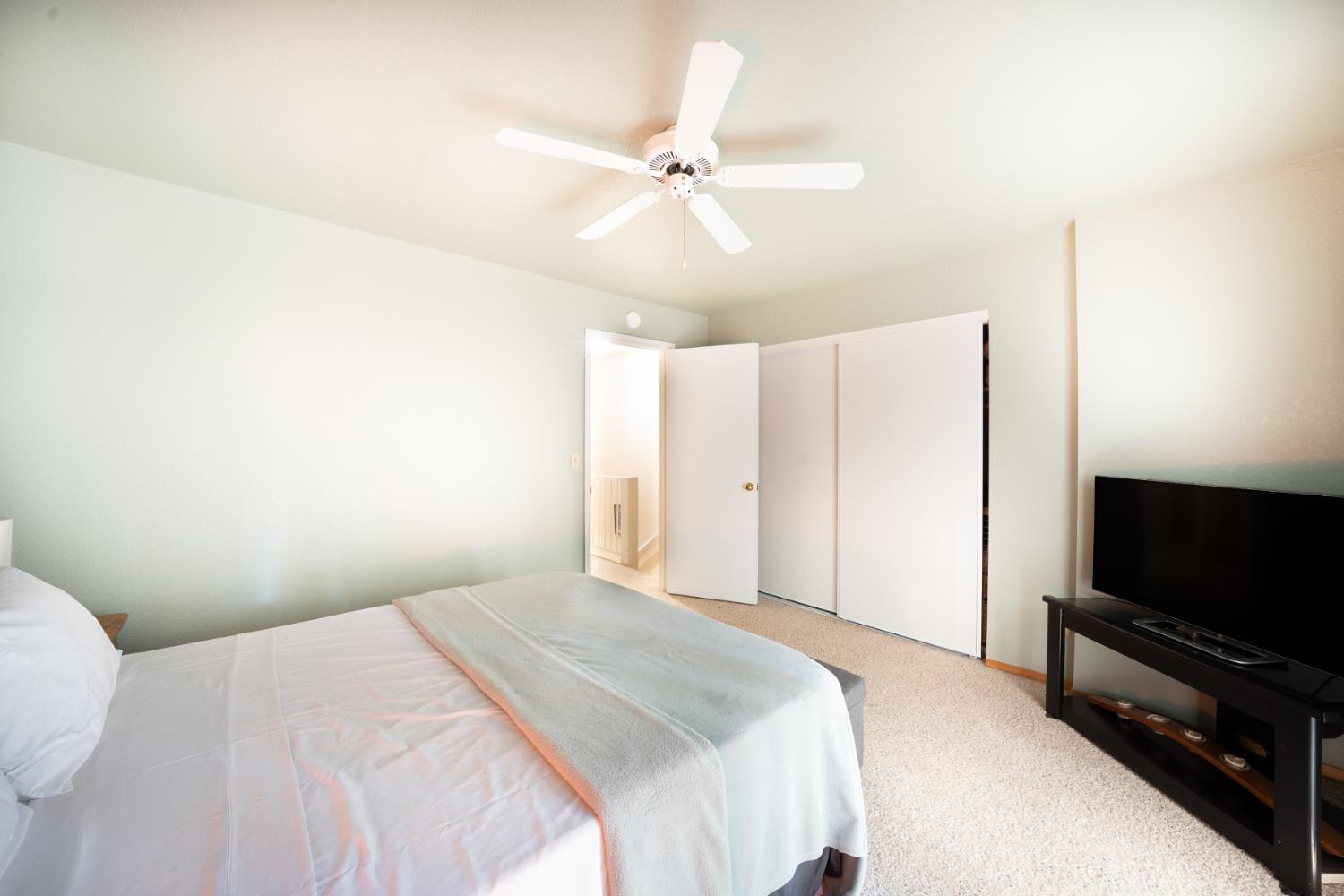 1002 Manuel Road Arnold, CA 95223 - Photo 12 of 34 a bedroom with a bed and a flat screen tv