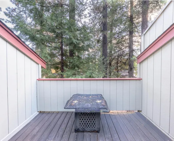 a view of balcony with wooden floor and outdoor seating