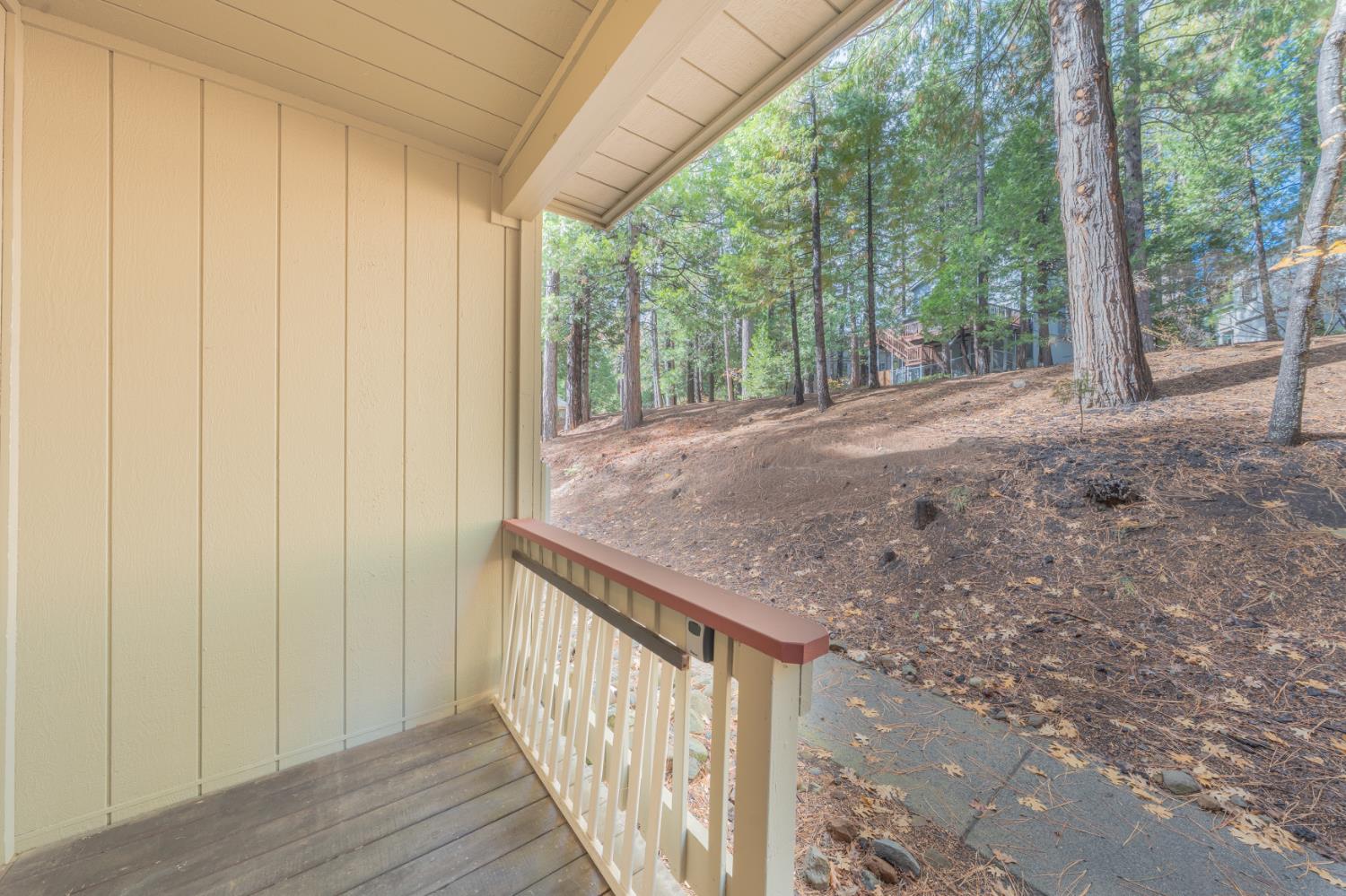 1002 Manuel Road Arnold, CA 95223 - Photo 24 of 34 a view of a porch with wooden floor and fence
