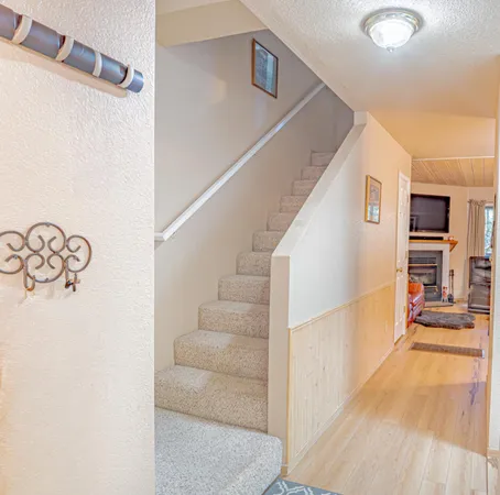a view of staircase with white walls
