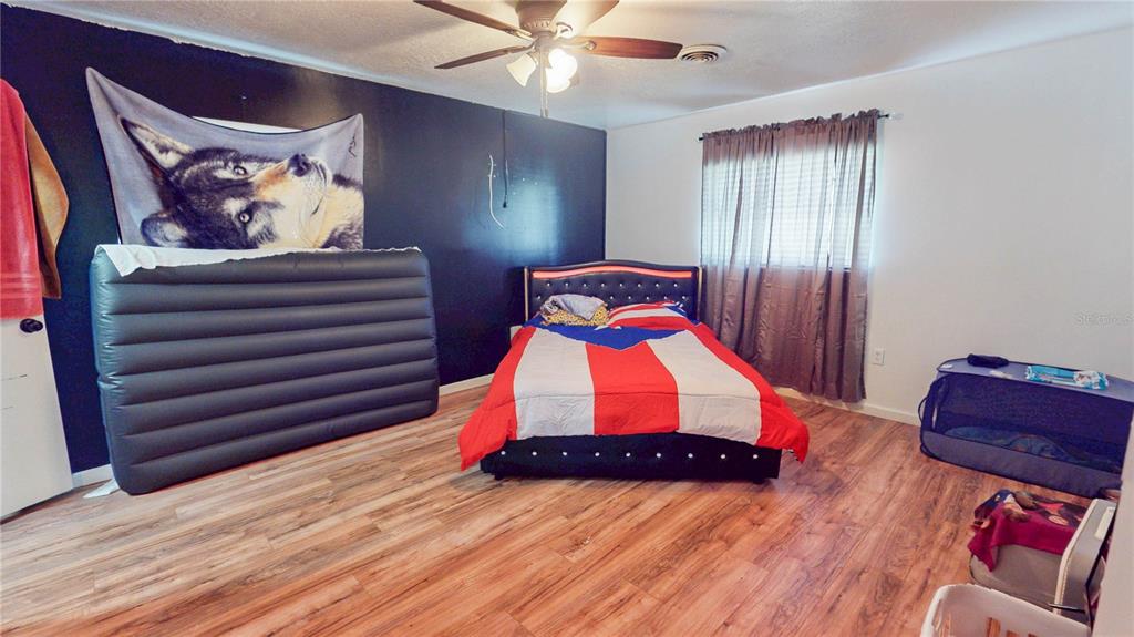 2009 Northeast 50th Street Ocala, FL 34479 - Photo 11 of 15 a room with furniture and wooden floor