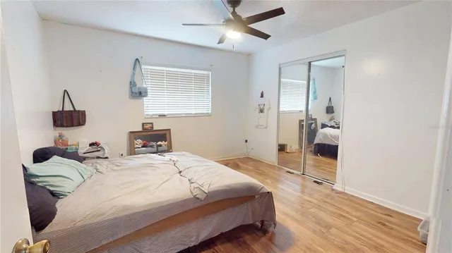 a front view of house with yard and trees in the background