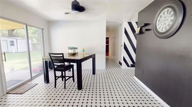 a view of a hallway with furniture