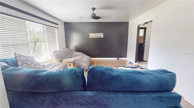 a bathroom with a granite countertop sink a mirror and a shower