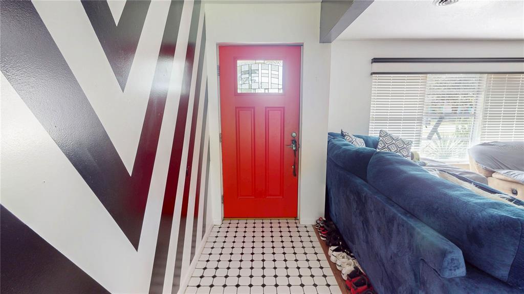 2009 Northeast 50th Street Ocala, FL 34479 - Photo 7 of 15 a living room with furniture and a rug
