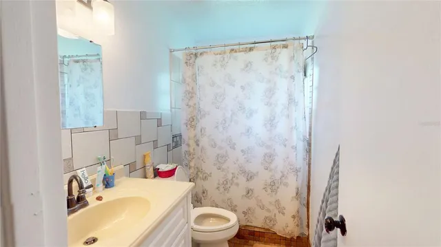 a bathroom with a sink and toilet