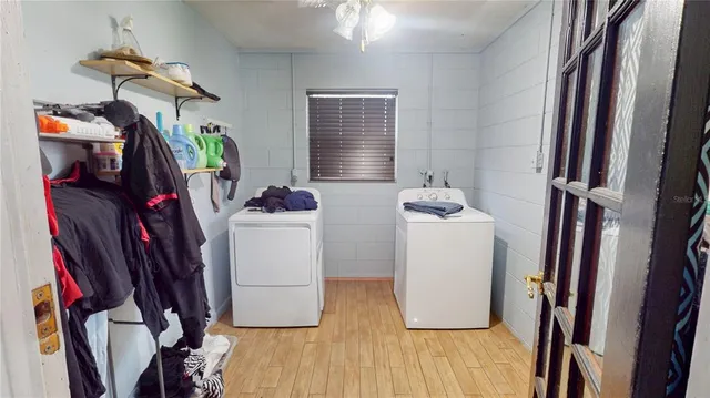 a room with furniture and wooden floor