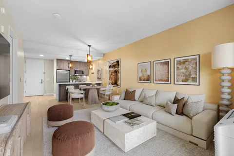 a room with lots of furniture and a large window