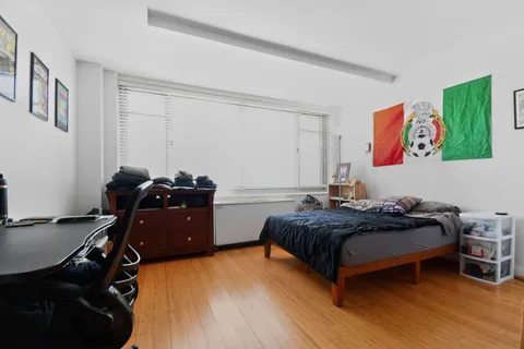 a bed room with a bed and furniture