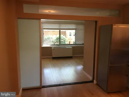 a view of kitchen with wooden floor and window