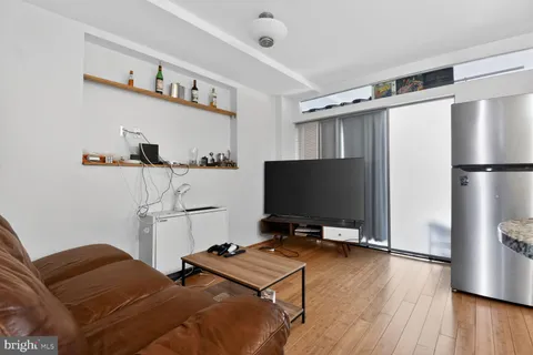 a room with furniture and a flat screen tv