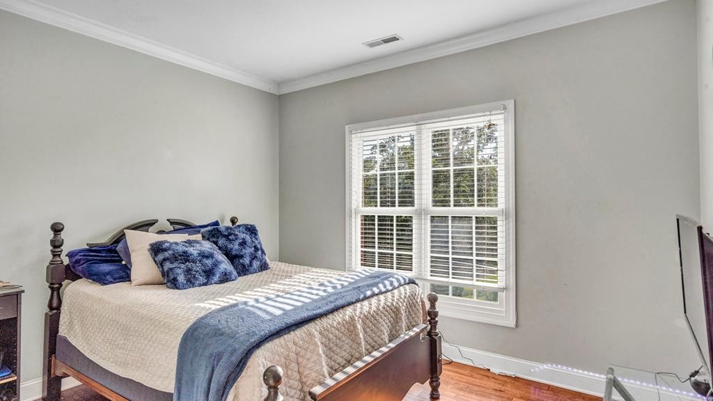 1797 Eads Bluff Road Northwest Georgetown, TN 37336 - Photo 31 of 61 a bedroom with a bed and wooden floor