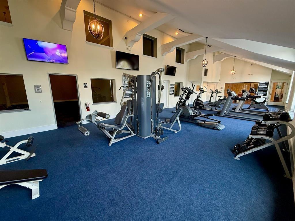 5120 Conroy Road, Unit 13 Orlando, FL 32811 - Photo 13 of 25 a view of a room with gym equipment