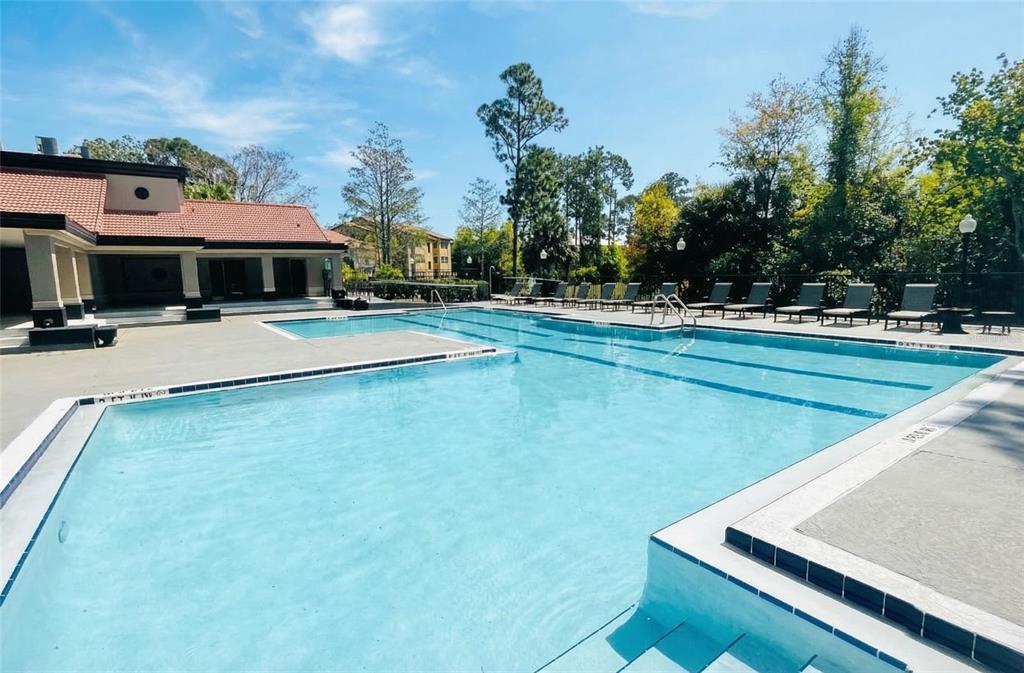 5120 Conroy Road, Unit 13 Orlando, FL 32811 - Photo 19 of 25 swimming pool view with a seating space