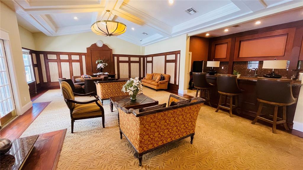 5120 Conroy Road, Unit 13 Orlando, FL 32811 - Photo 25 of 25 a living room with furniture a rug and a chandelier