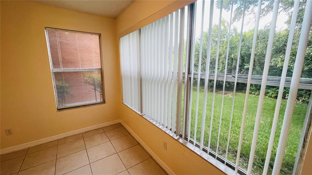 5120 Conroy Road, Unit 13 Orlando, FL 32811 - Photo 3 of 25 a view of a garden from a windows