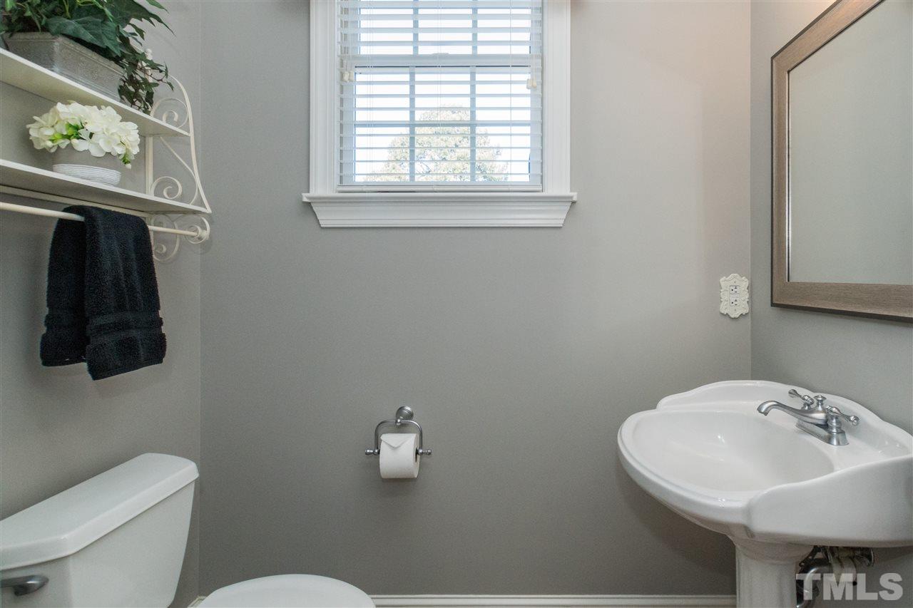 1000 Nortonbridge Road Raleigh, NC 27603 - Photo 13 of 30 a bathroom with a sink a mirror and a toilet
