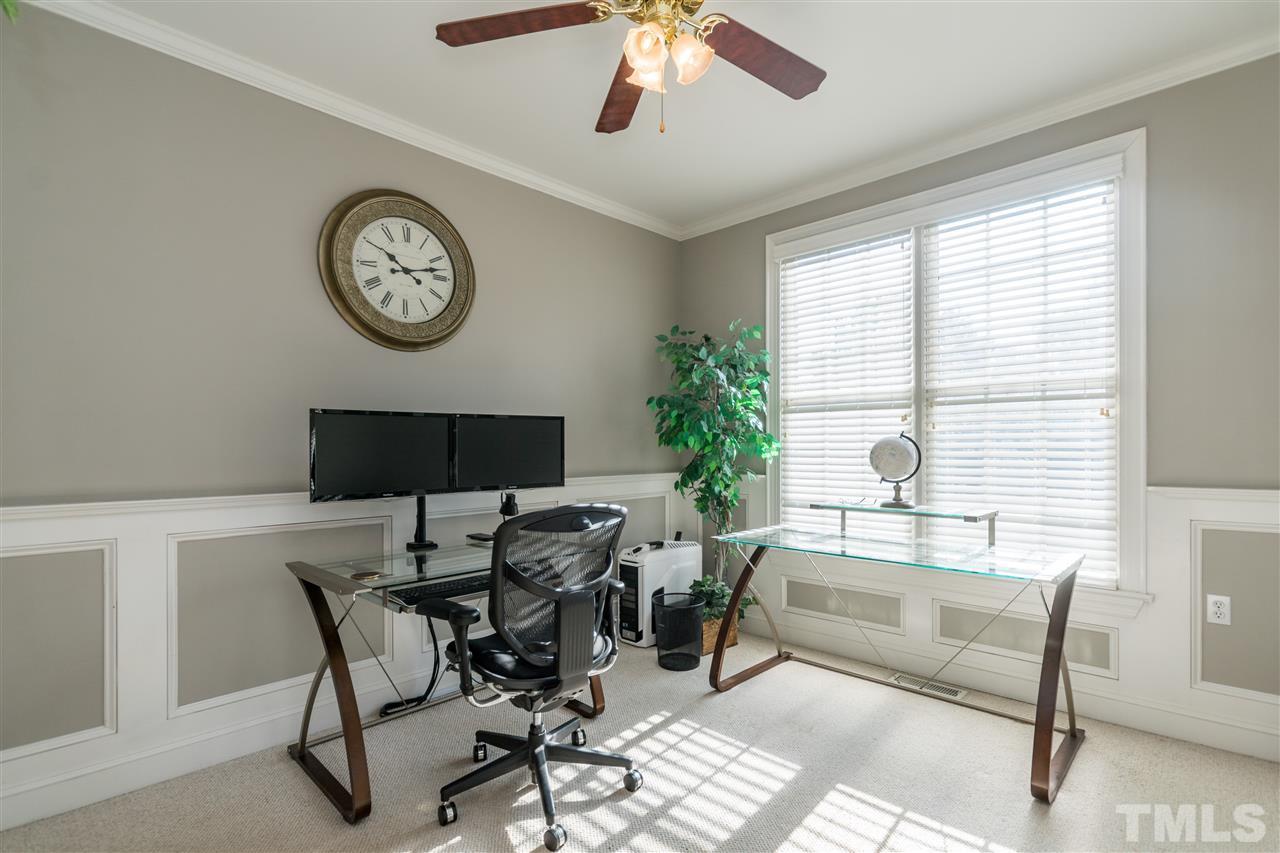 1000 Nortonbridge Road Raleigh, NC 27603 - Photo 14 of 30 a living room with furniture a large window and a potted plant