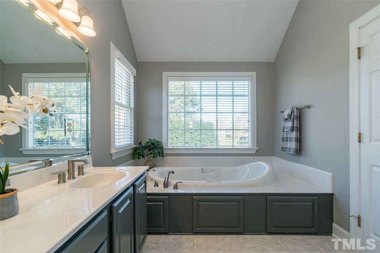 1000 Nortonbridge Road Raleigh, NC 27603 - Photo 18 of 30 a bathroom with a sink and a bathtub