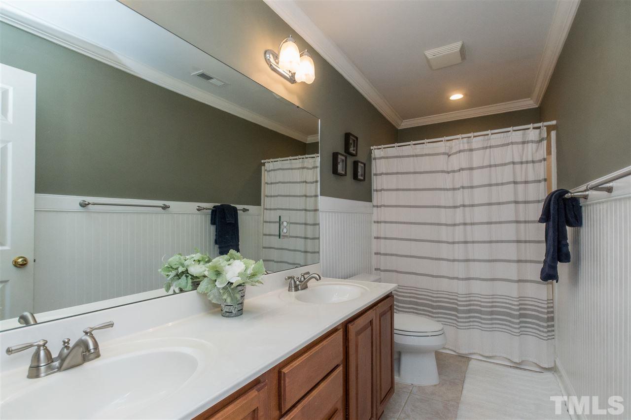 1000 Nortonbridge Road Raleigh, NC 27603 - Photo 21 of 30 a bathroom with a sink toilet and shower