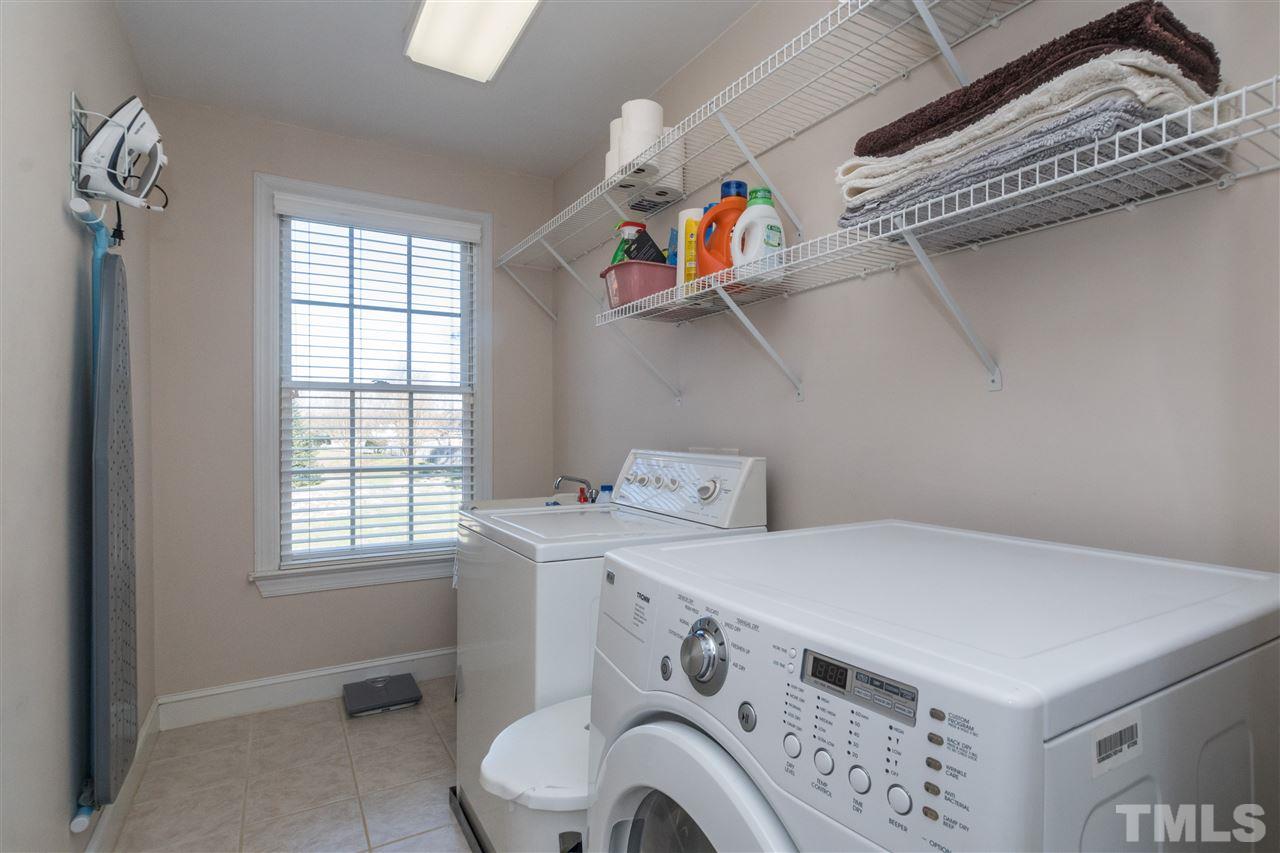 1000 Nortonbridge Road Raleigh, NC 27603 - Photo 23 of 30 a utility room with dryer and washer