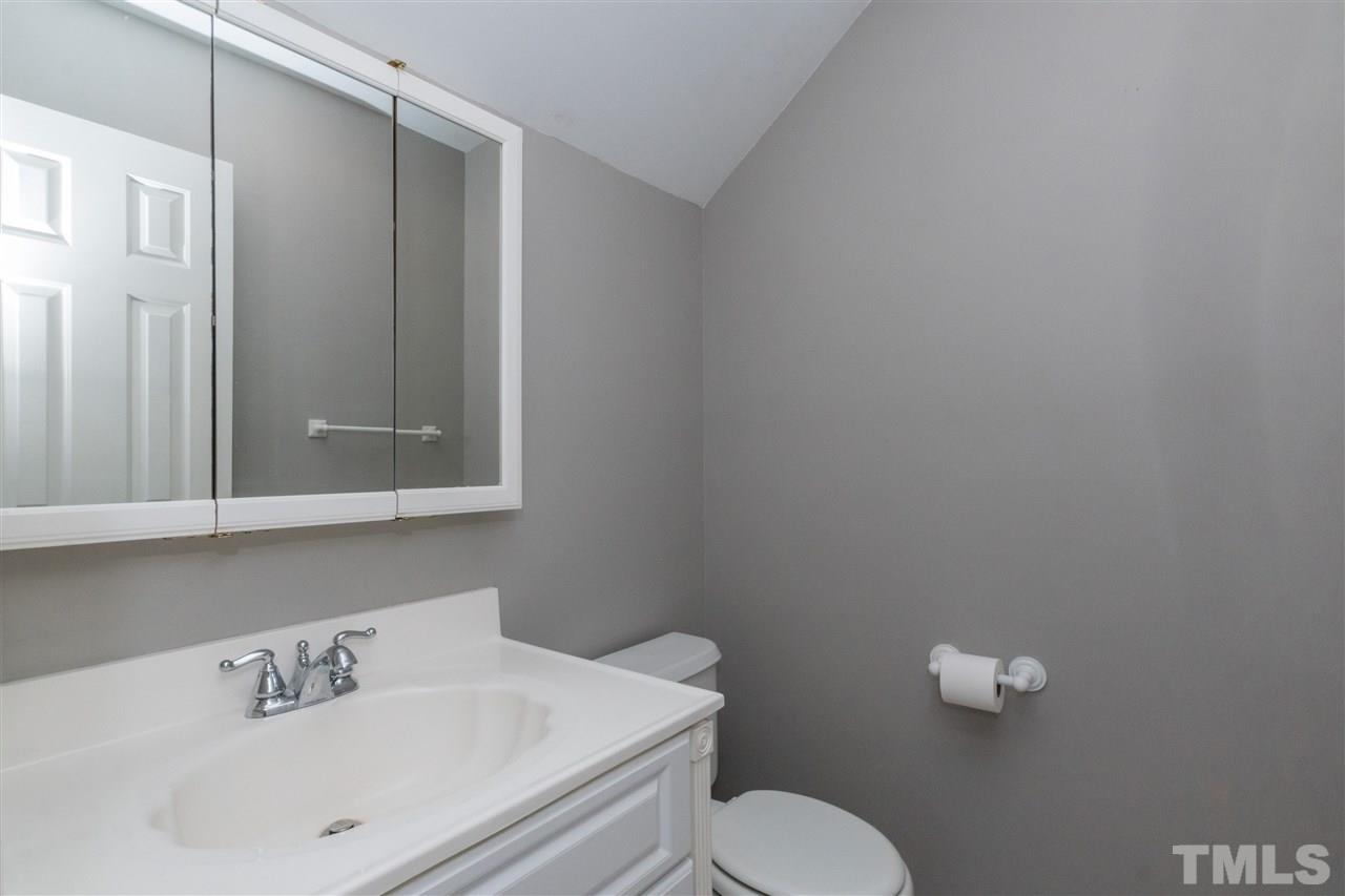 1000 Nortonbridge Road Raleigh, NC 27603 - Photo 28 of 30 a bathroom with a sink mirror and toilet