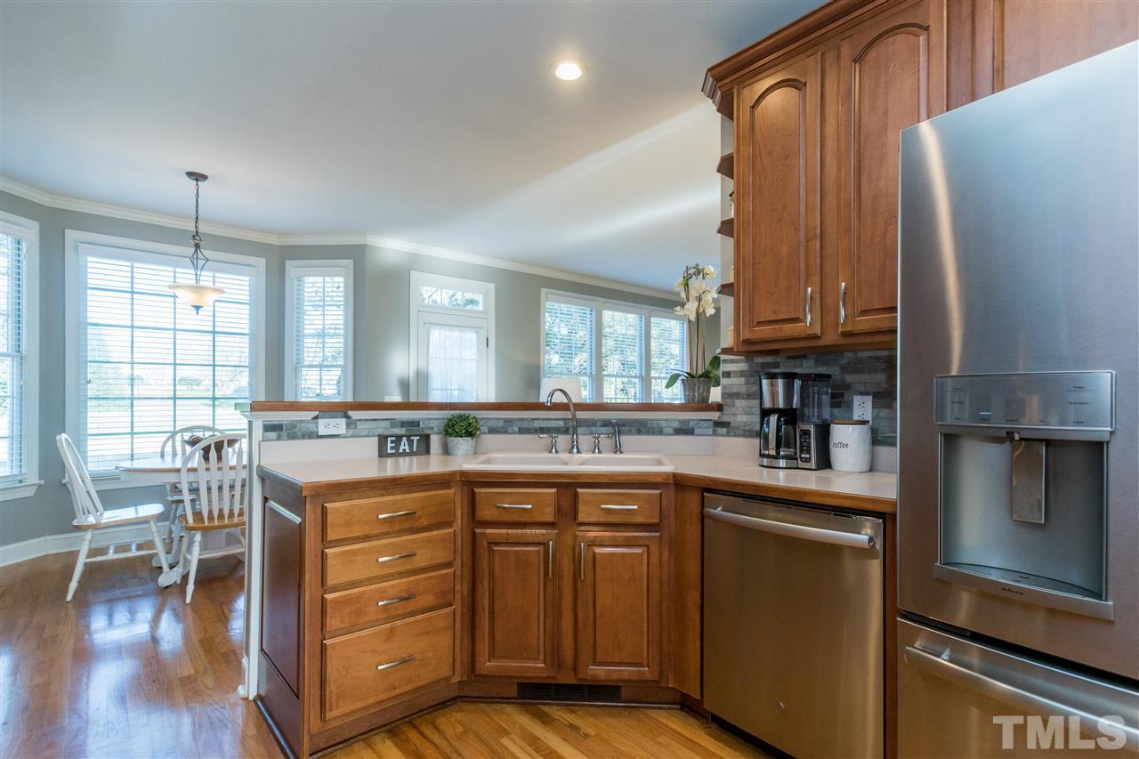1000 Nortonbridge Road Raleigh, NC 27603 - Photo 5 of 30 a kitchen with a sink stove and cabinets