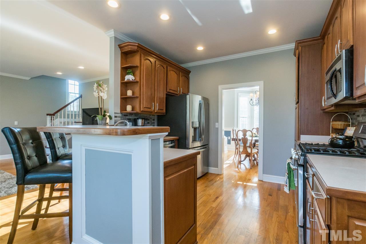 1000 Nortonbridge Road Raleigh, NC 27603 - Photo 6 of 30 a kitchen with cabinets and wooden floor
