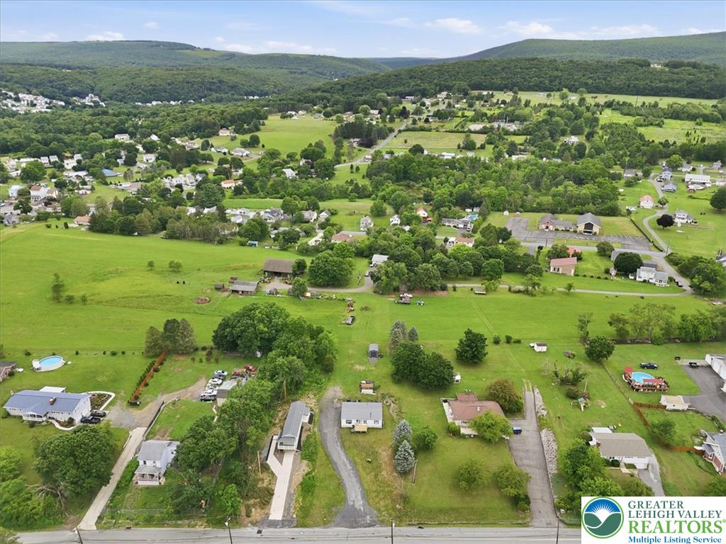 634 Main Road Lehighton, PA 18235 - Photo 36 of 39 Rolling hills provide a scenic backdrop to this community with ample green spaces and various properties.