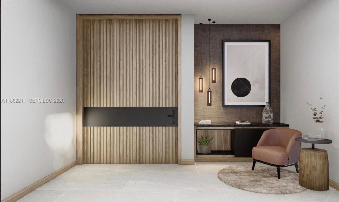 2664 Southwest 17th Avenue Miami, FL 33133 - Photo 2 of 32 a kitchen with a refrigerator and a chair