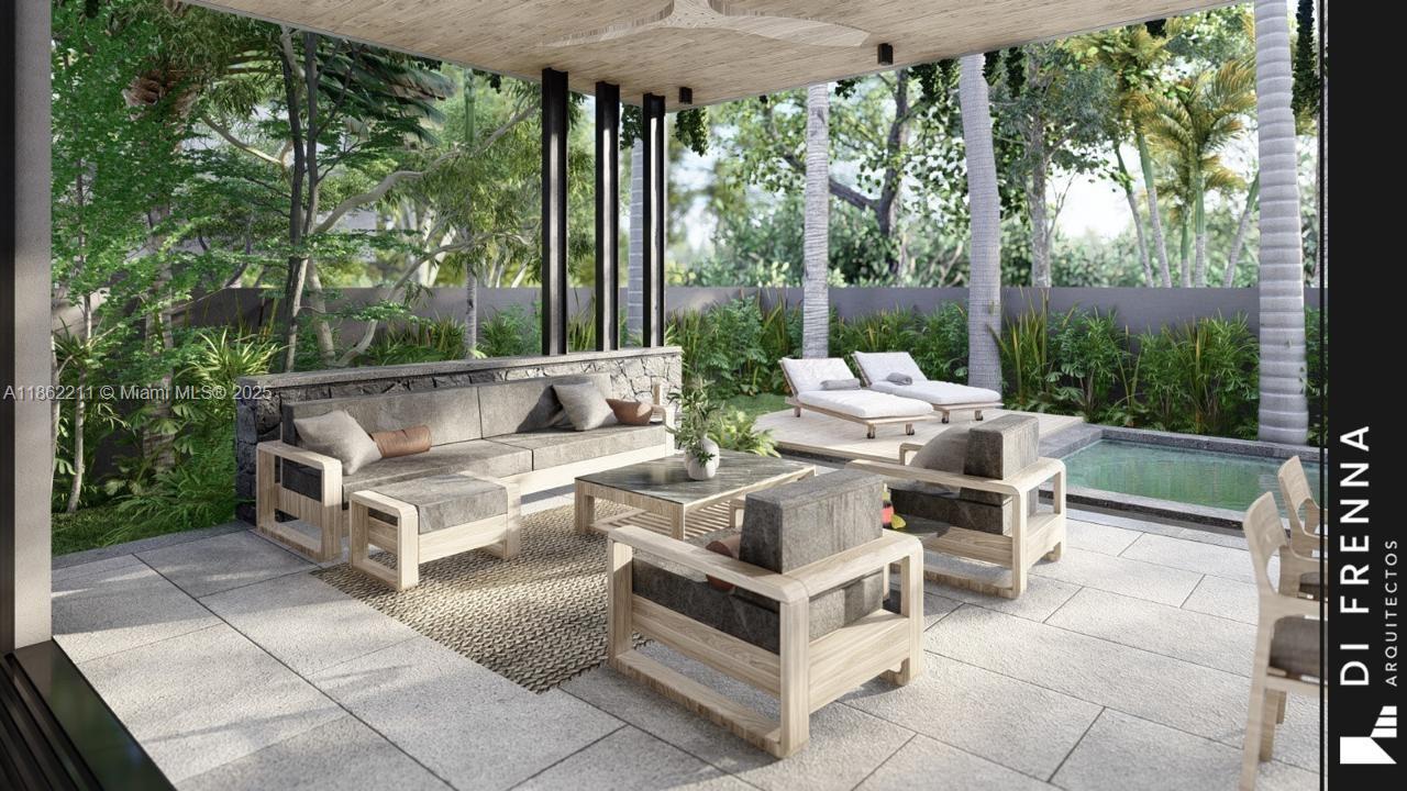 2664 Southwest 17th Avenue Miami, FL 33133 - Photo 23 of 56 a view of a patio with couches and table and chairs with wooden fence