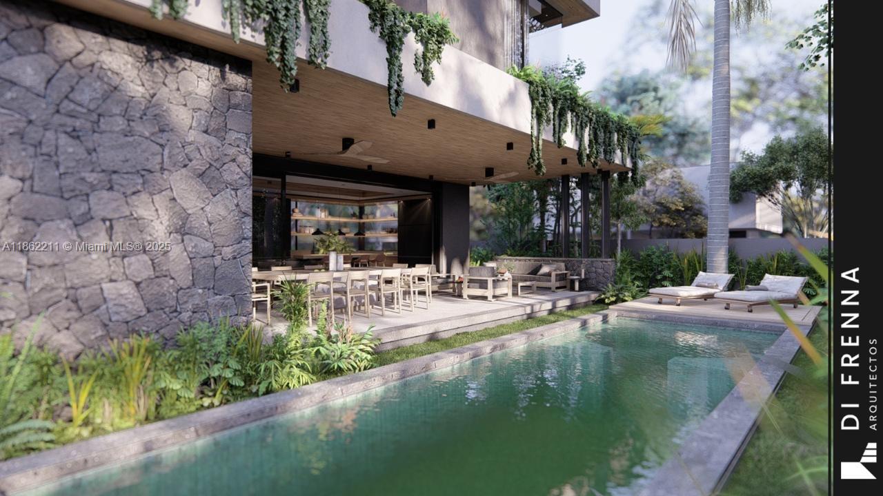 2664 Southwest 17th Avenue Miami, FL 33133 - Photo 28 of 56 a view of pool with lawn chairs and plants