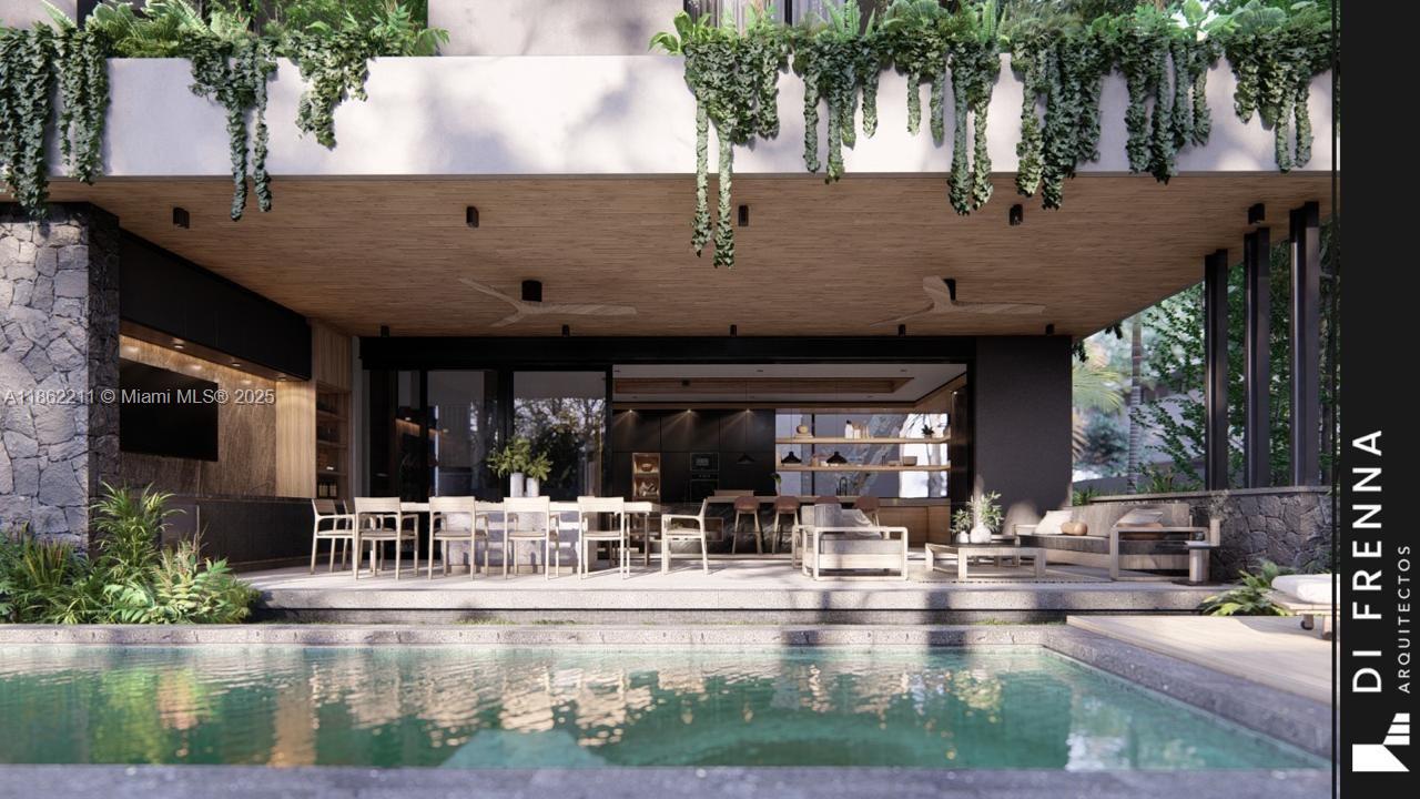 2664 Southwest 17th Avenue Miami, FL 33133 - Photo 29 of 56 a view of a patio with table and chairs potted plants and large tree