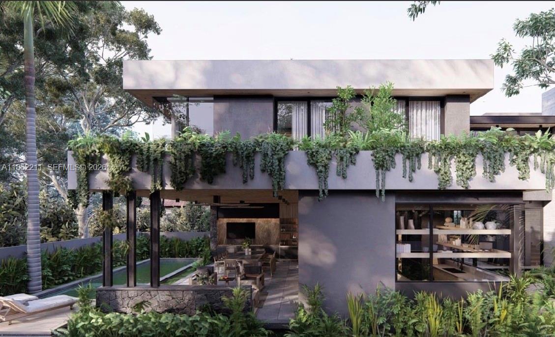 2664 Southwest 17th Avenue Miami, FL 33133 - Photo 31 of 32 a front view of a house with porch and outdoor seating