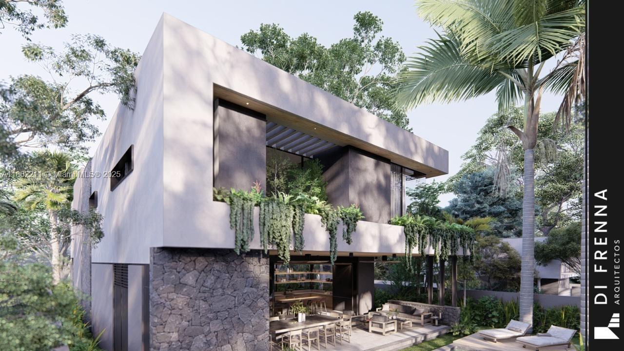 2664 Southwest 17th Avenue Miami, FL 33133 - Photo 33 of 56 a view of a patio with table and chairs potted plants and large tree