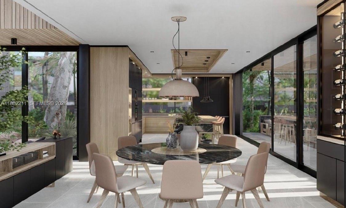 2664 Southwest 17th Avenue Miami, FL 33133 - Photo 9 of 32 a dining room with furniture wooden floor and a chandelier