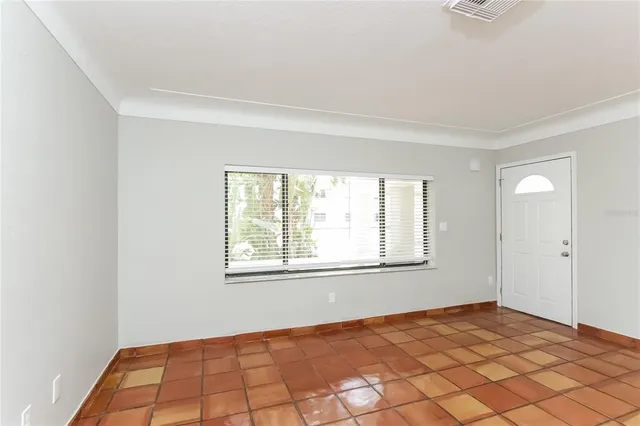 a view of an empty room and window
