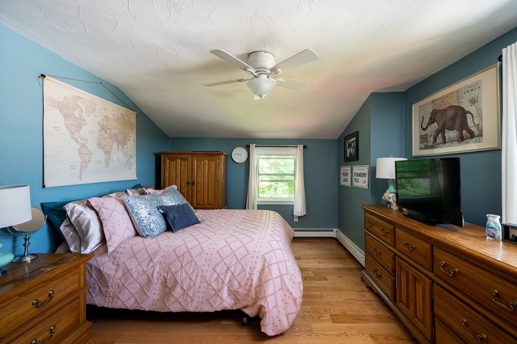 29 Wituwamat Road Weymouth, MA 02191 - Photo 27 of 42 a bedroom with a bed and a flat screen tv