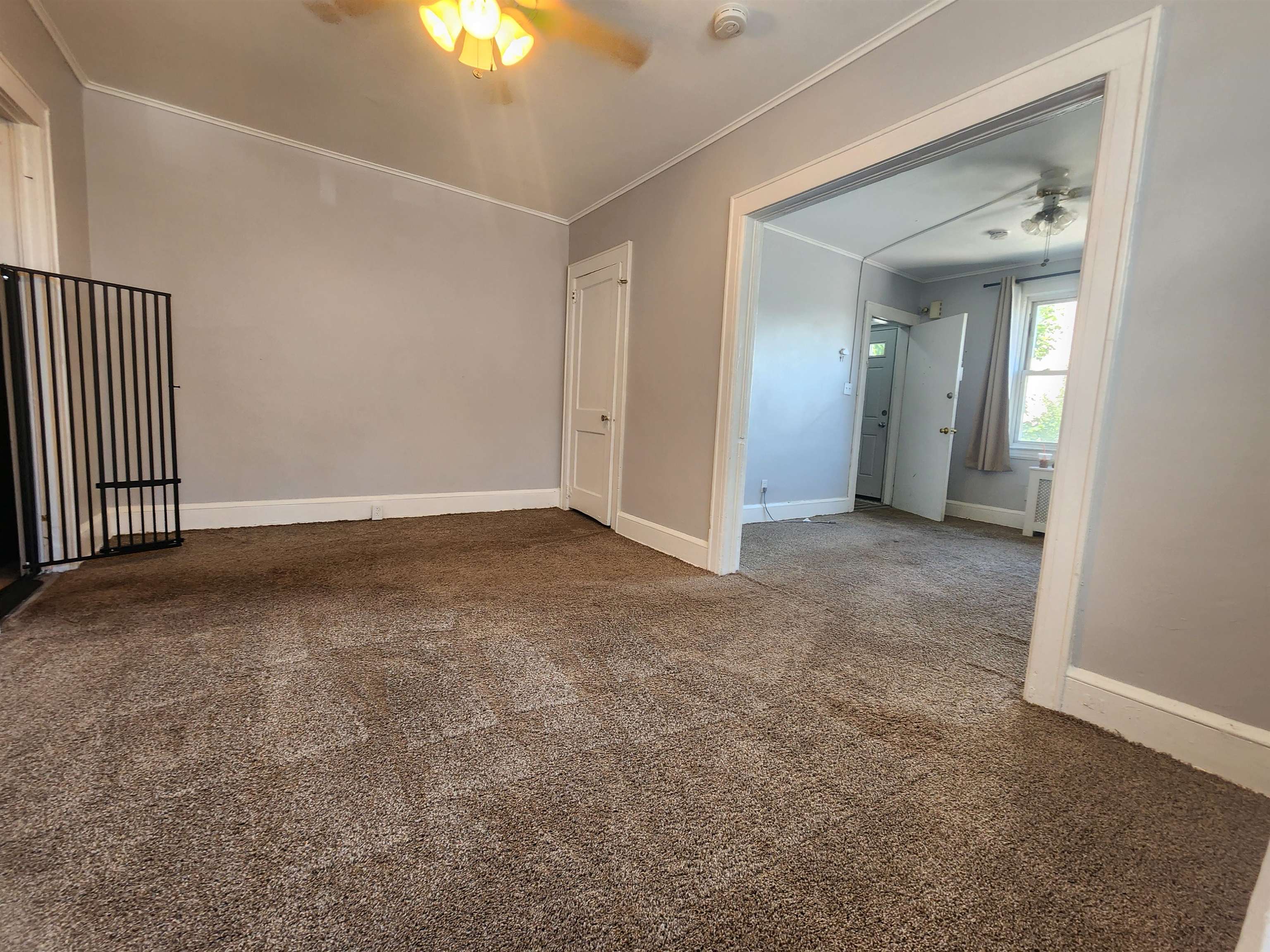 261 Centre Avenue, Unit 1 Secaucus, NJ 07094 - Photo 4 of 11 an empty room with windows and fan