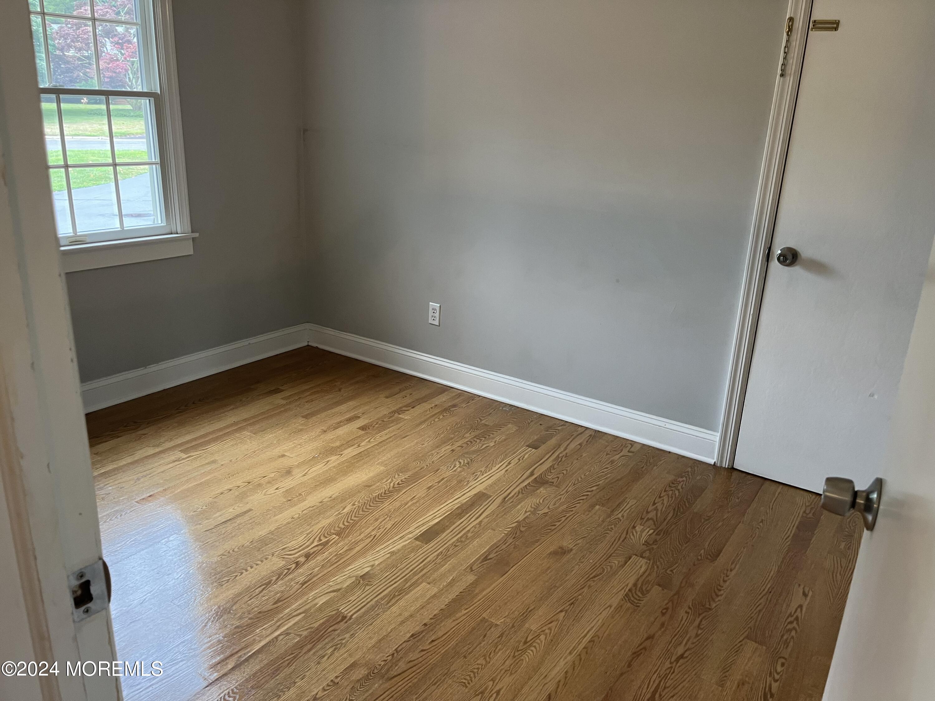 22 Robin Road Rumson, NJ 07760 - Photo 19 of 24 a view of empty room with wooden floor and fan